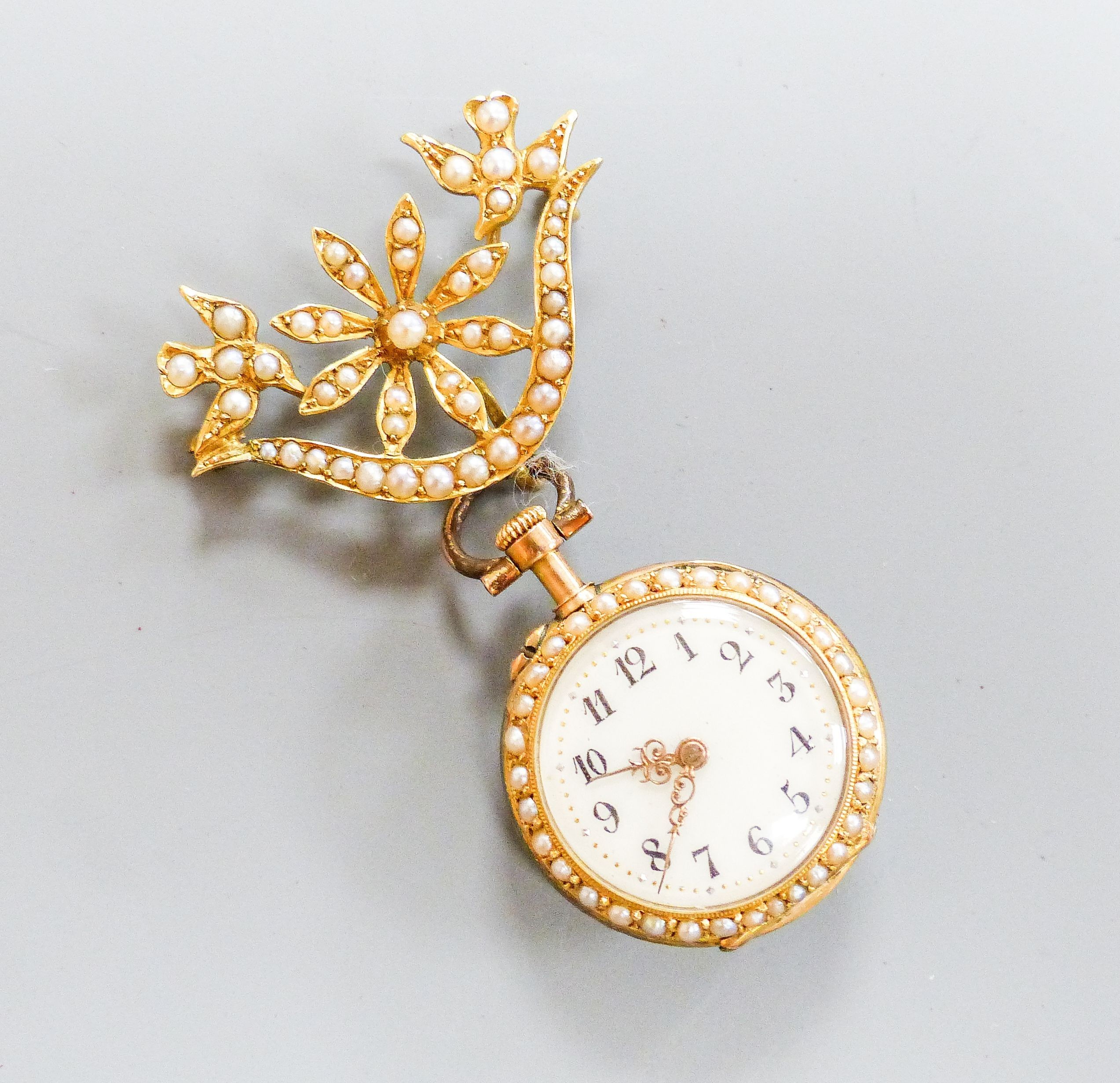 A continental yellow metal, rose cut diamond and split pearl set open face fob watch, case diameter 22mm, on an associated 15ct and seed pearl suspension brooch (a.f.)